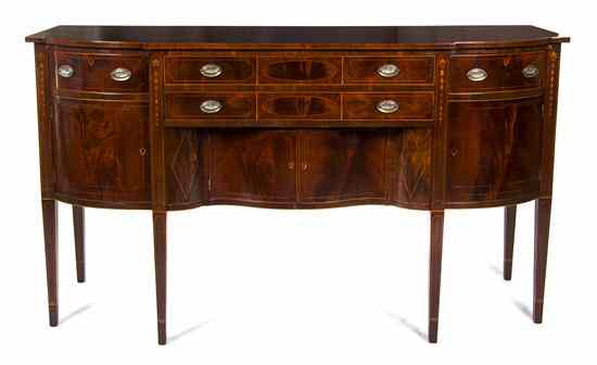 Appraisal: An American Federal Mahogany Sideboard having bow front side sections