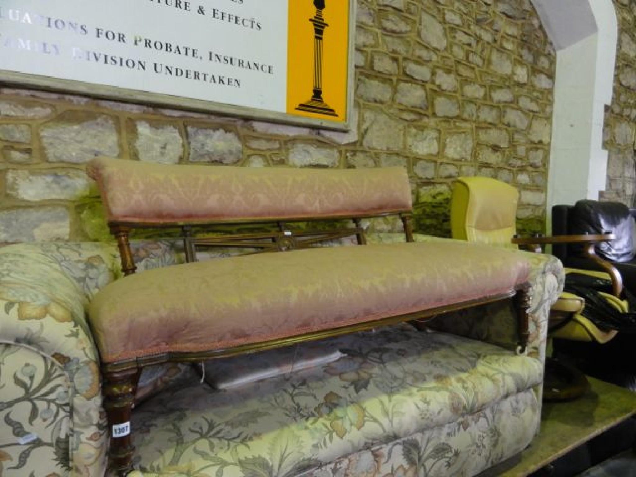 Appraisal: A low Victorian couch with floral patterned upholstered seat and