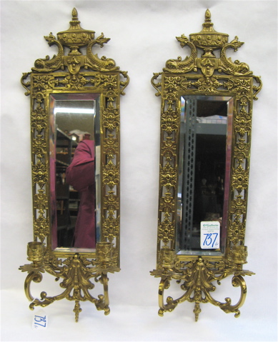 Appraisal: PAIR OF BRASS MIRRORED SCONCES the beveled mirror framed in