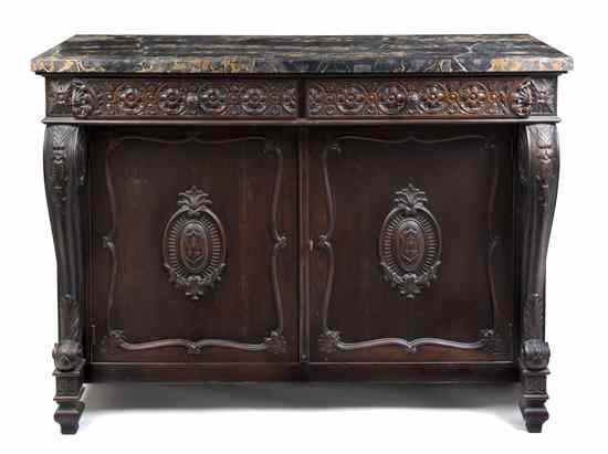 Appraisal: A Continental Oak Sideboard having a rectangular marble top over