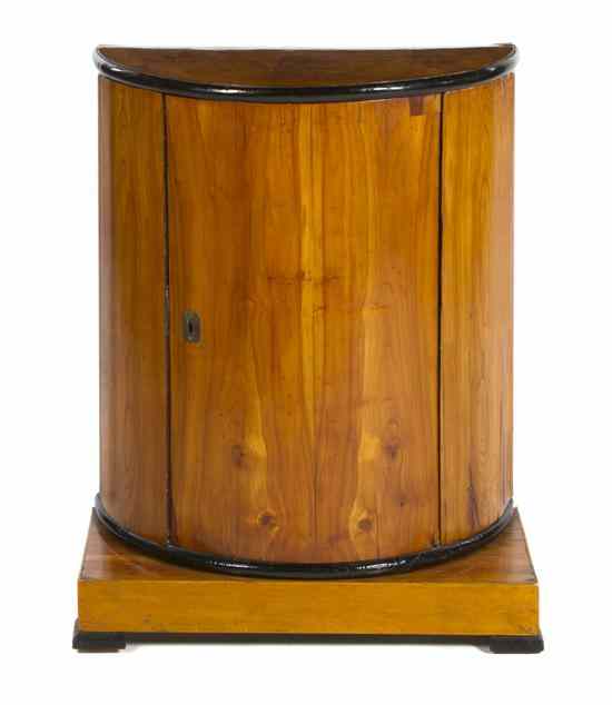 Appraisal: A Biedermeier Console Cabinet the demilune cabinet fitted with a