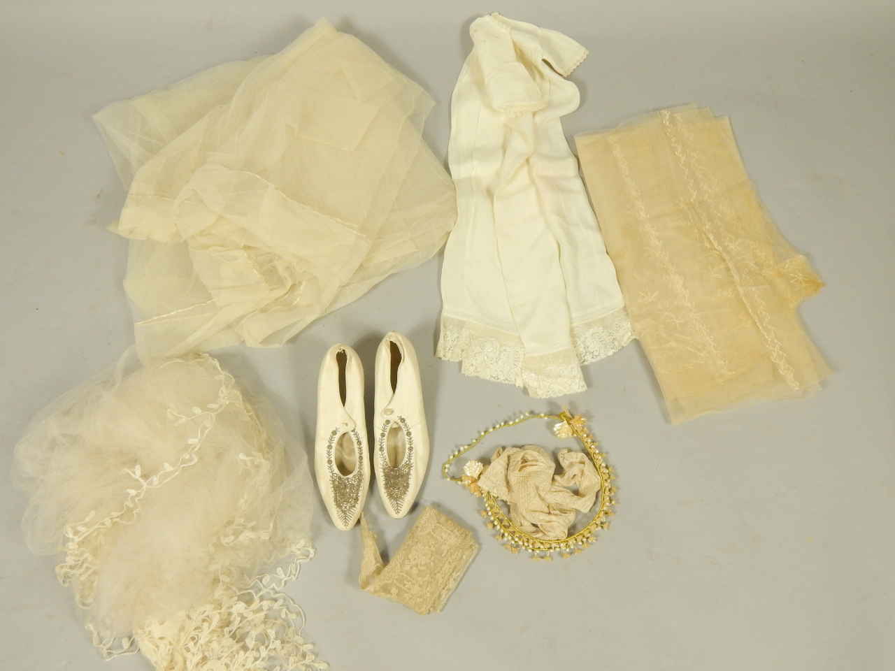 Appraisal: A vintage wedding veil and accessories including a pair of