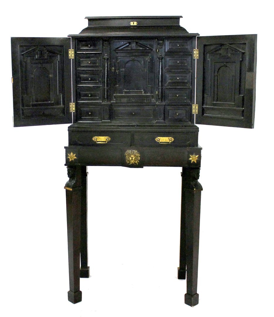 Appraisal: A th century German ebonised cabinet on stand the pair