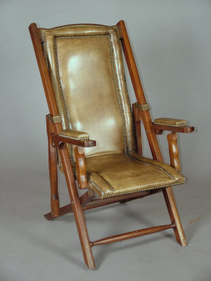 Appraisal: A late Victorian hide covered campaign chair the folding chair