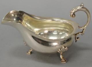 Appraisal: Elkington Co silver gravy boat with scroll handle on three