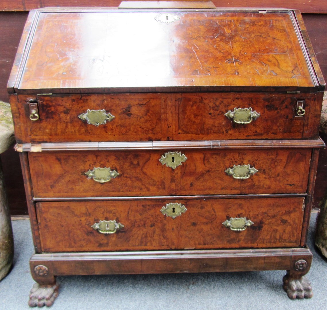 Appraisal: An early th century figured walnut two section bureau the