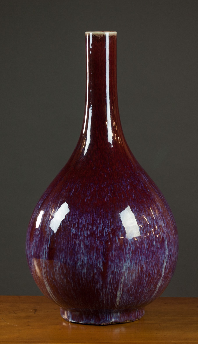 Appraisal: CHINESE FLAMBE GLAZED PORCELAIN VASE bottle form with variegated red