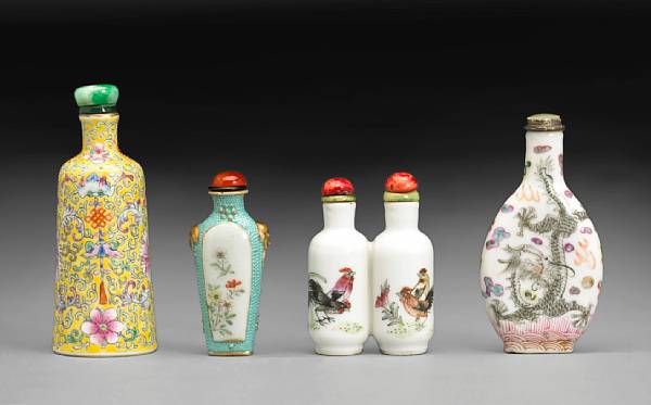 Appraisal: Four enamel decorated porcelain snuff bottles The first painted with