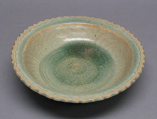 Appraisal: A Si Satchanalai celadon glazed stoneware dish Thailand th Century