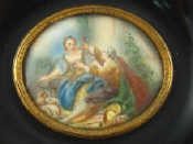 Appraisal: A miniature painting on ivory of young lovers in ebonised