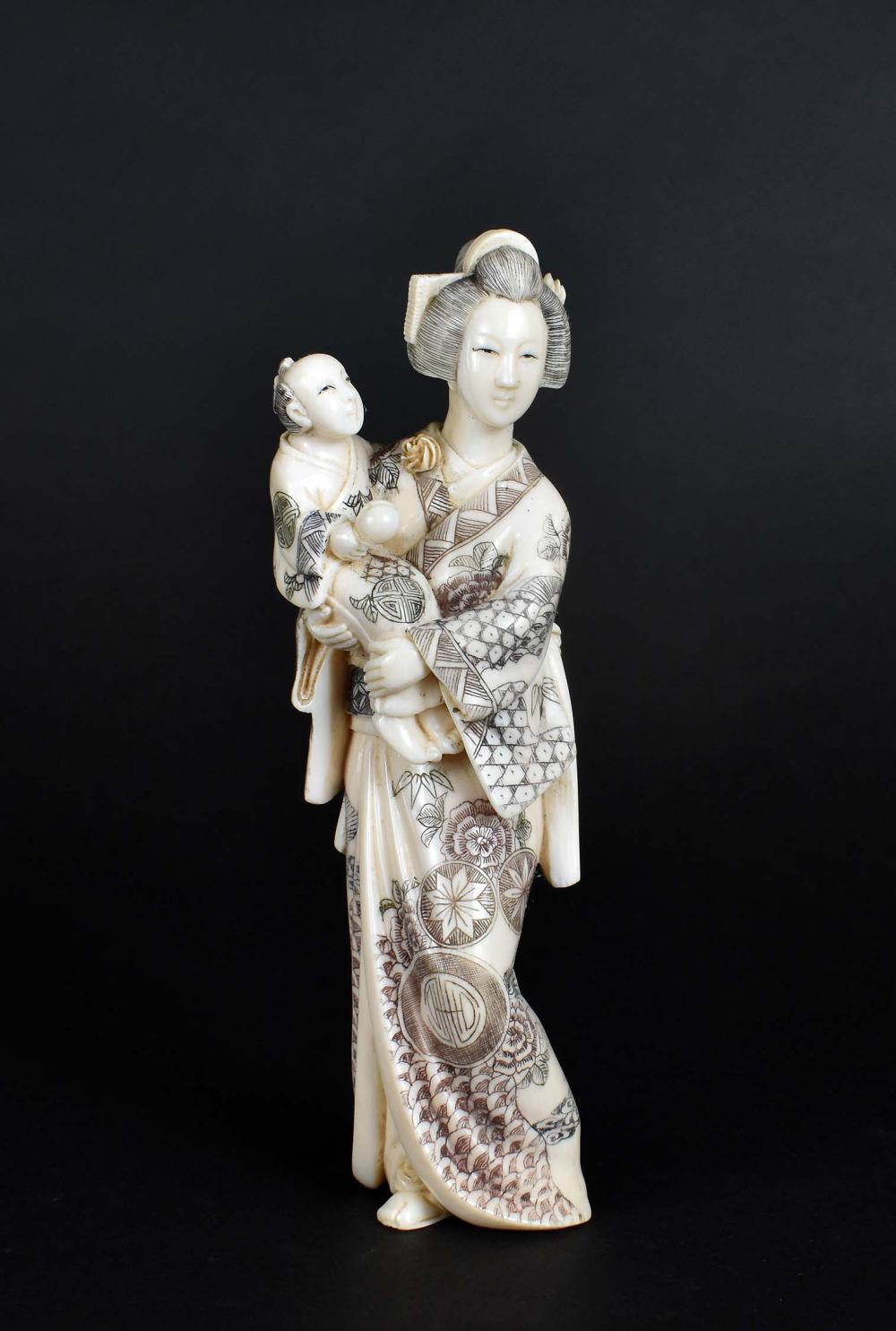 Appraisal: JAPANESE OKIMONO OF A MOTHER AND CHILDMeiji period The underside