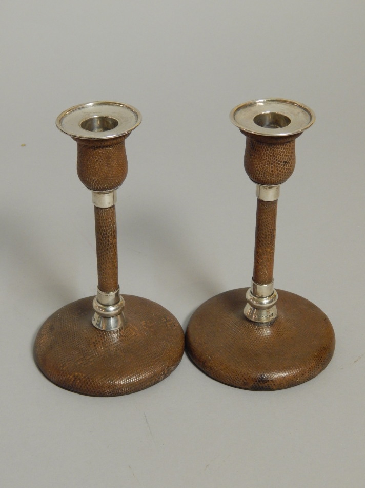 Appraisal: A pair of Victorian silver and brown snakeskin leather candlesticks