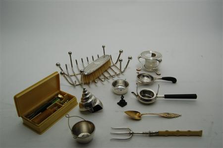 Appraisal: A group of various silver and other tea strainers and