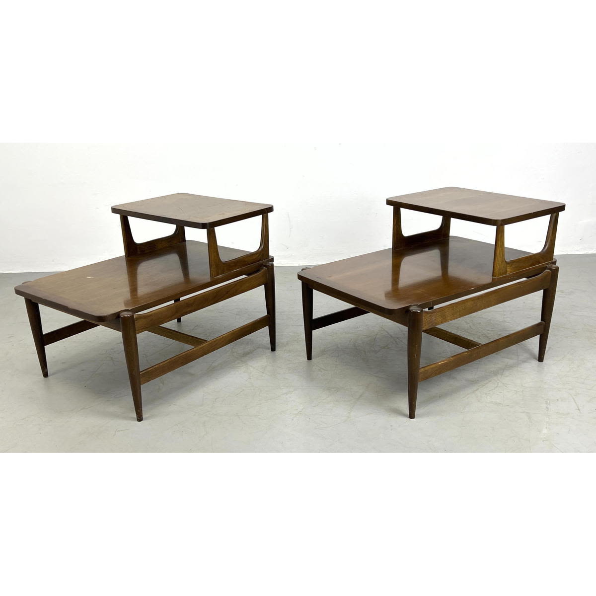 Appraisal: Pr Bassett walnut tier step end tables American Modern walnut