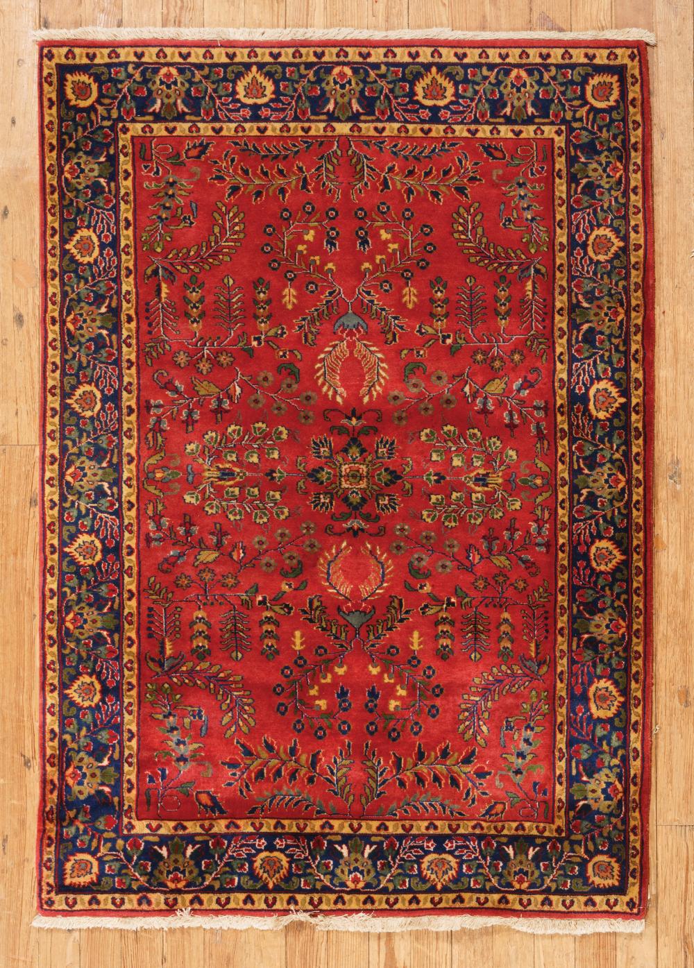 Appraisal: Persian Rug red ground blue border overall foliate design ft