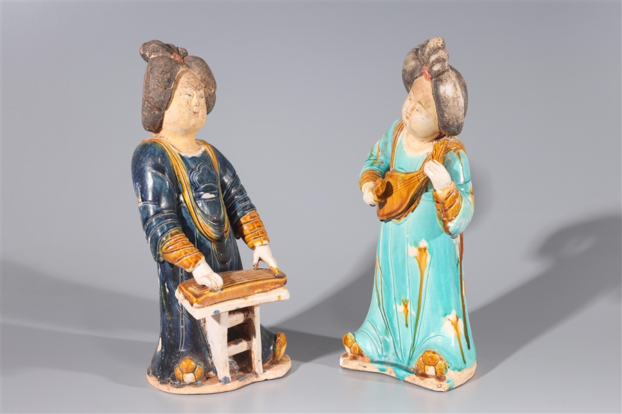 Appraisal: Pair of Chinese ceramic female musician statues with partial glaze