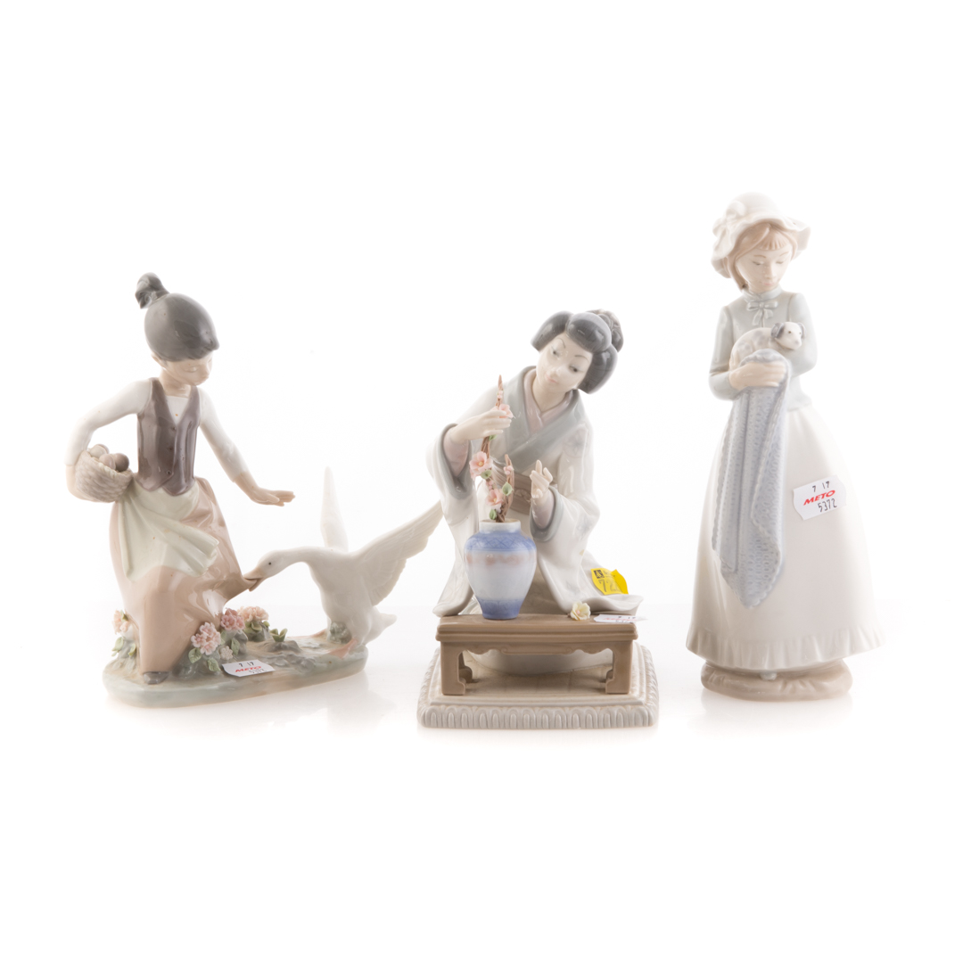 Appraisal: Two Lladro porcelain groups Nao figure Geisha with vase and