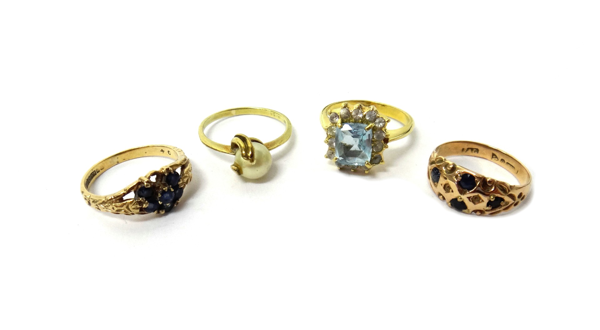 Appraisal: A gold aquamarine and colourless gem set cluster ring detailed