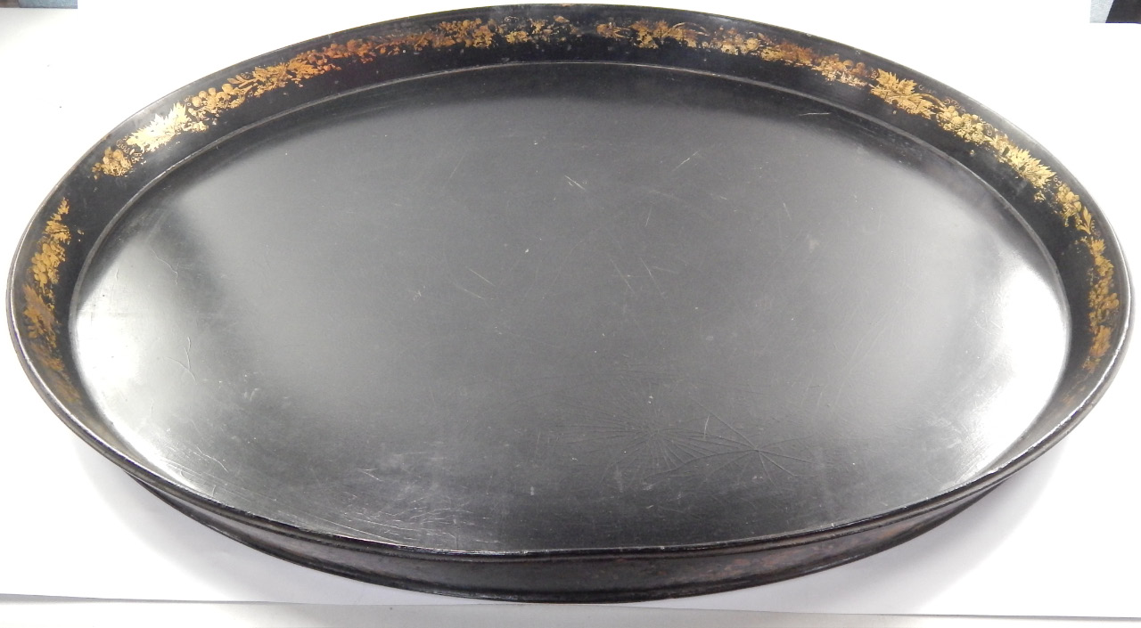 Appraisal: A Victorian oval galleried papier mache tray gilt decorated externally