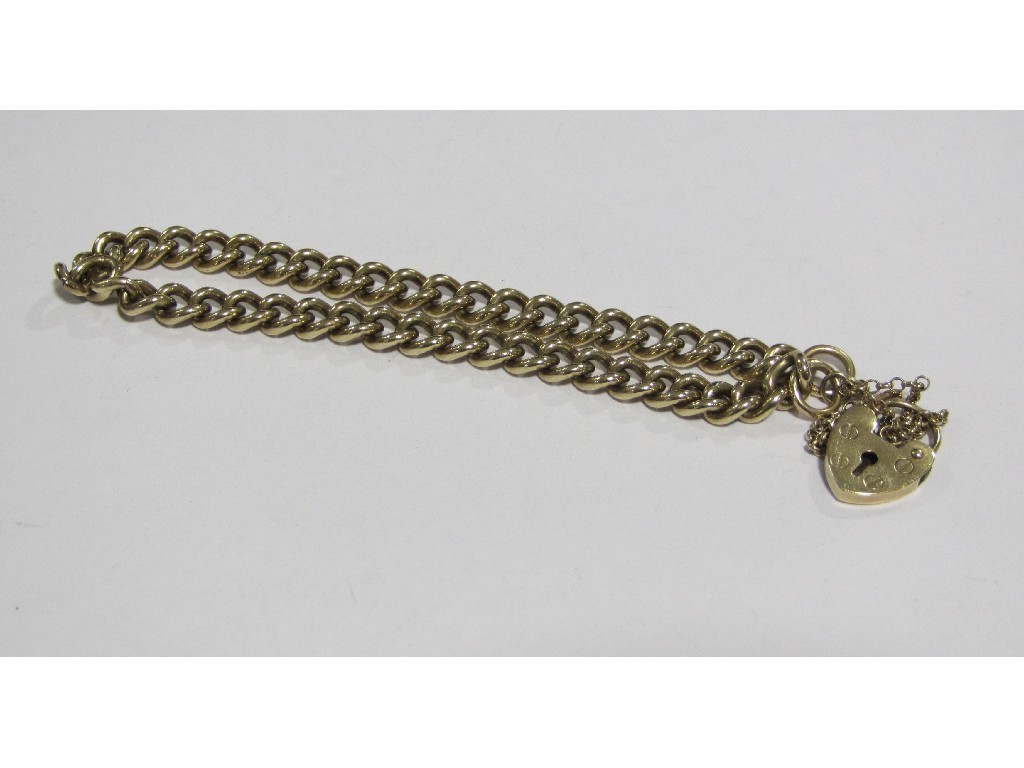 Appraisal: Nine carat gold curb link bracelet complete with padlock and