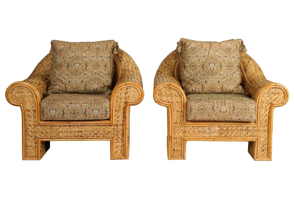 Appraisal: PAIR OF RATTAN OVERSIZED ARMCHAIRSunsigned with paisley fabric cushions inches