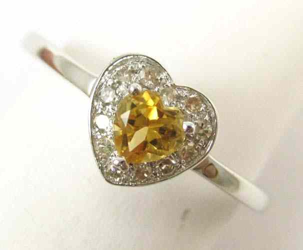 Appraisal: CITRINE DIAMOND AND FOURTEEN KARAT GOLD RING The white gold