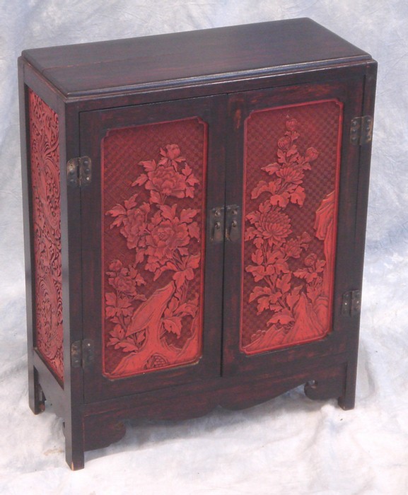 Appraisal: Chinese door cabinet with carved cinnabar panels in doors and