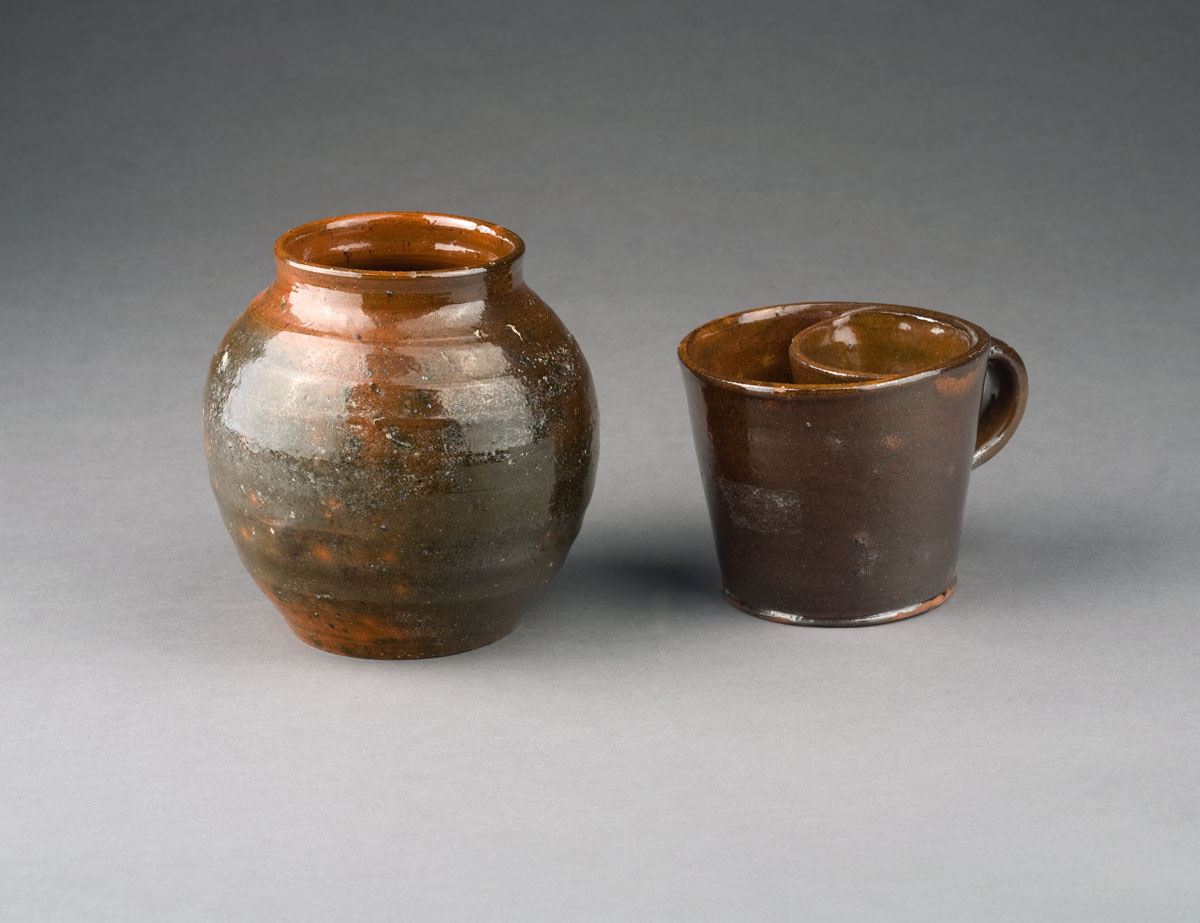 Appraisal: NEW ENGLAND REDWARE SHAVING MUG AND A BULBOUS JAR Height