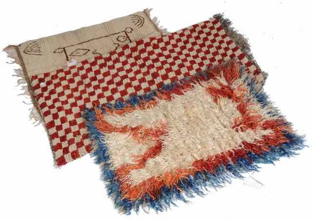 Appraisal: A TIBETAN WOOLLEN TSU-TRUK SLEEPING RUG decorated alternating red and