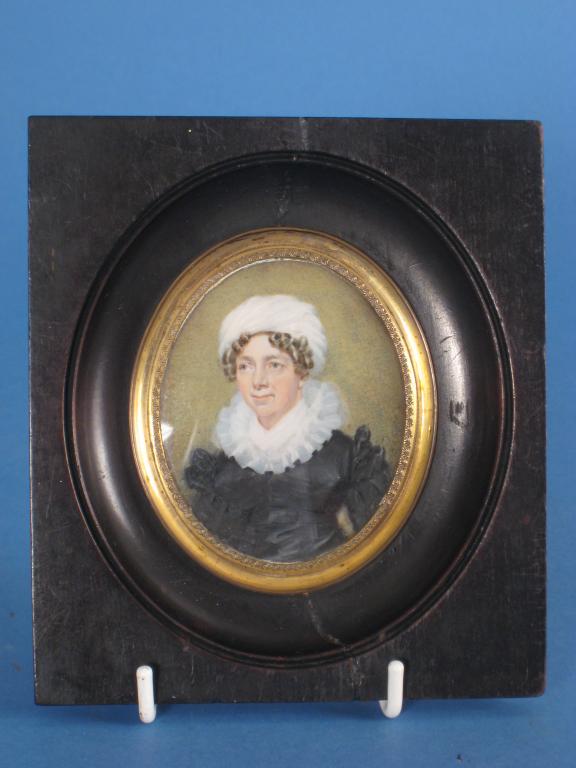 Appraisal: ENGLISH SCHOOL CIRCA Portrait miniature of a Lady wearing a