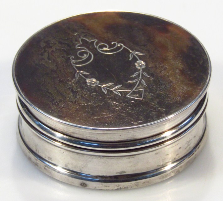 Appraisal: An Edwardian silver and polished tortoiseshell trinket box in the