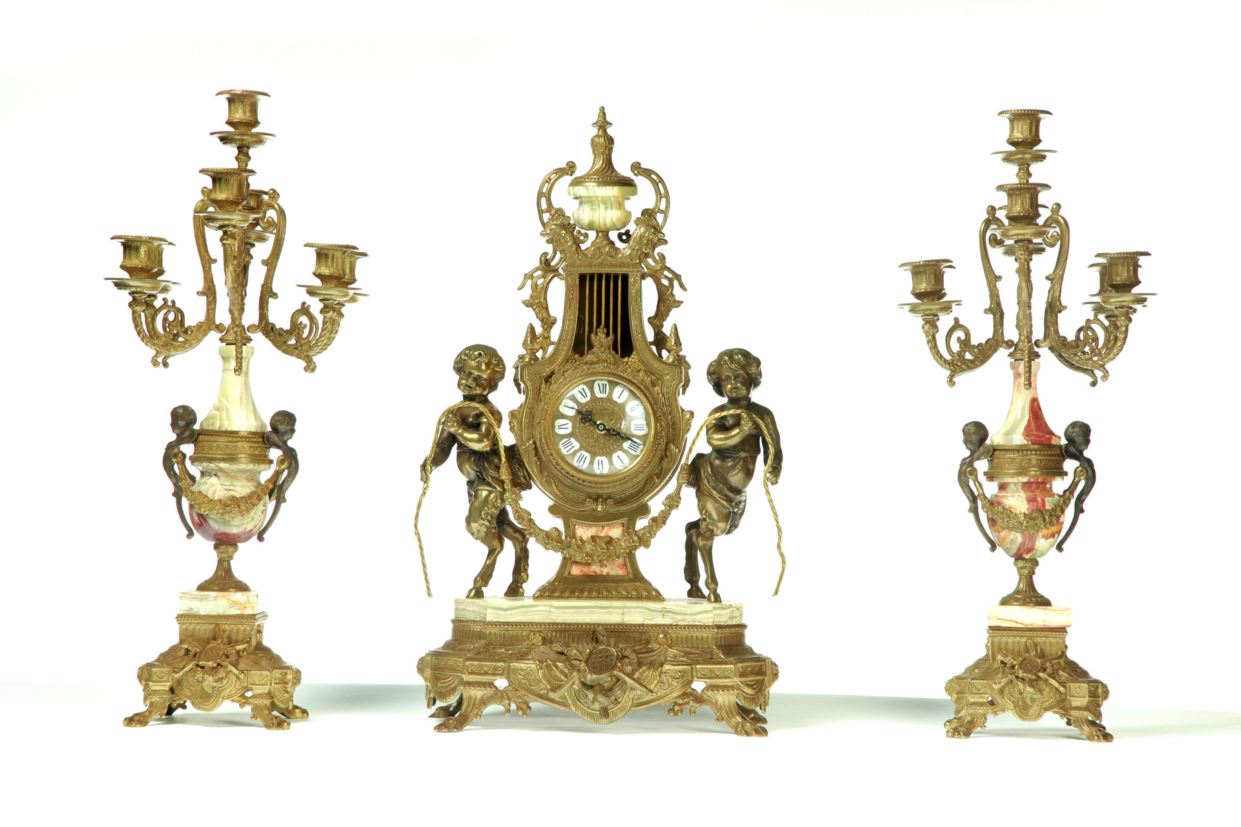 Appraisal: ITALIAN MANTEL SET Twentieth century Pair of cast brass and