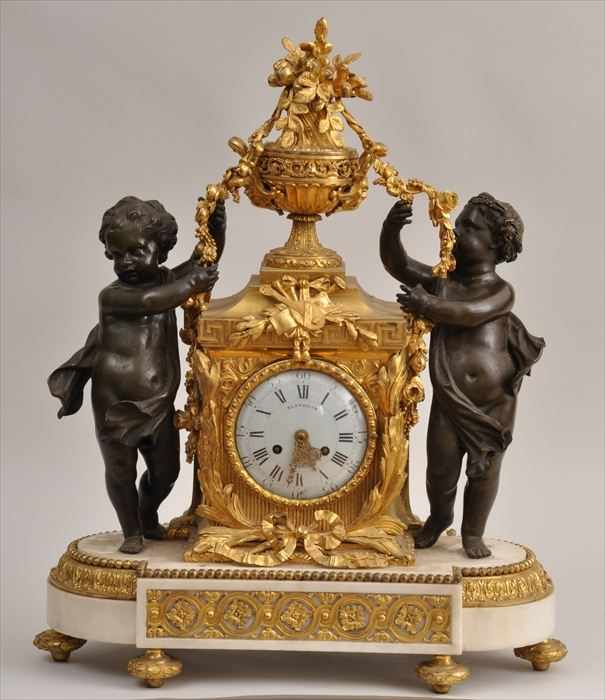 Appraisal: LOUIS XVI-STYLE MARBLE BRONZE AND GILT-METAL CLOCK The enamel dial