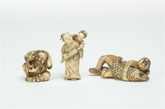 Appraisal: THREE IVORY NETSUKES Japan late th-early th century Child with