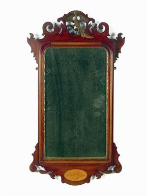 Appraisal: A mahogany fret frame wall mirror with a rectangular plate