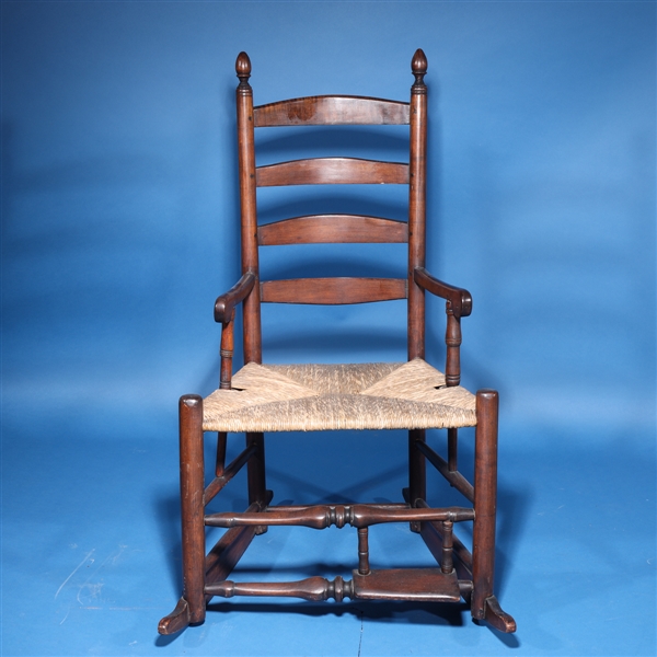 Appraisal: Early th century wooden rocking chair with wicker seat overall