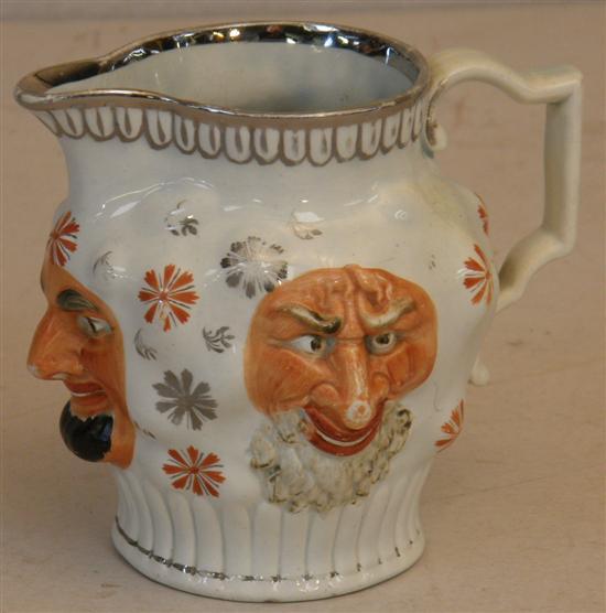 Appraisal: th century Staffordshire jug decorated with three faces in relief