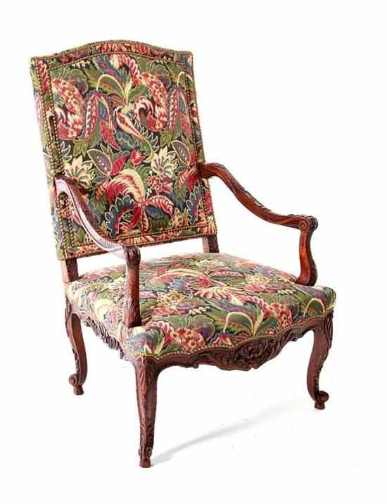 Appraisal: Louis XV style carved walnut armchair serpentine overupholstered back emitting