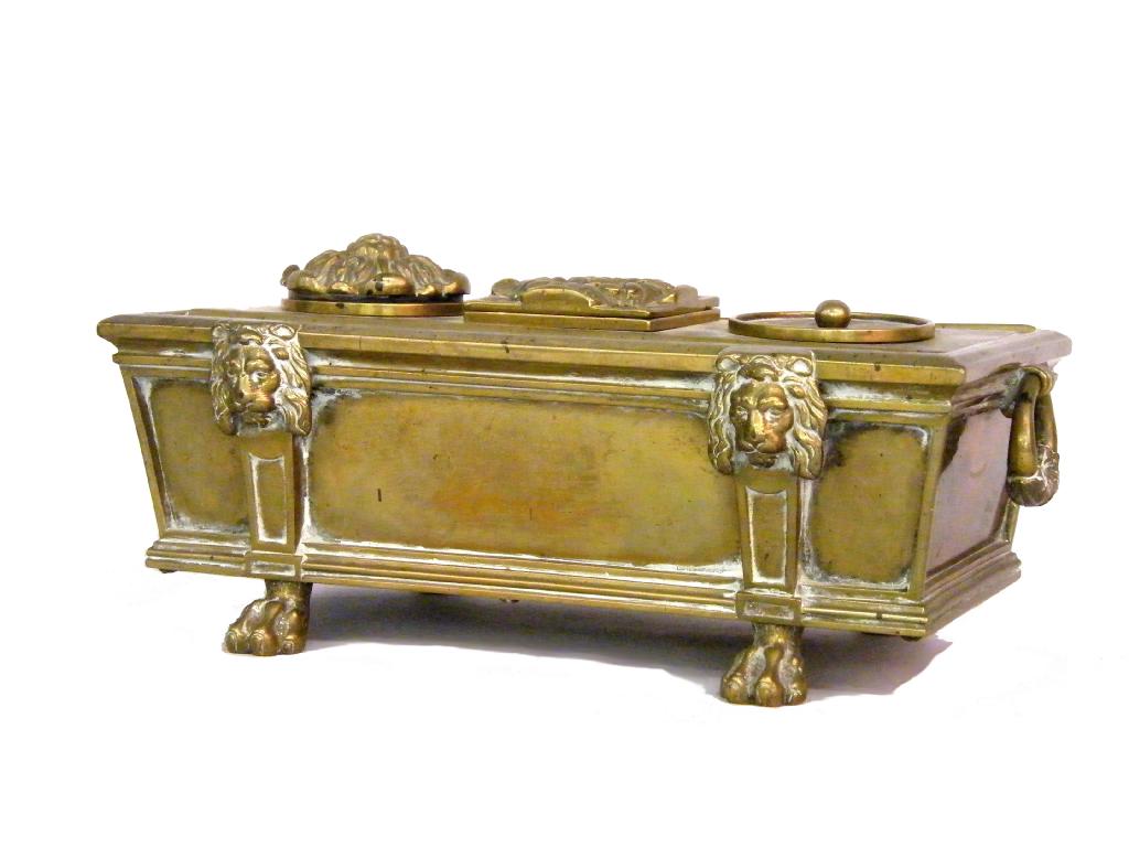 Appraisal: Regency ormolu inkstand of sarcophagus form cast with lions' heads