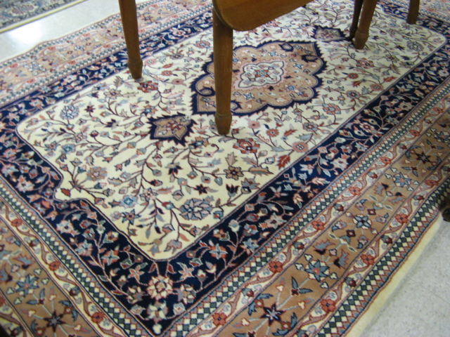 Appraisal: HAND KNOTTED ORIENTAL CARPET Indo-Persian floral and central floral medallion