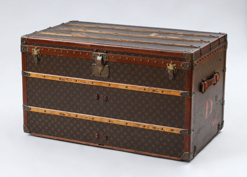 Appraisal: LOUIS VUITTON BRASS LEATHER AND WOOD-MOUNTED TRUNK With residue of