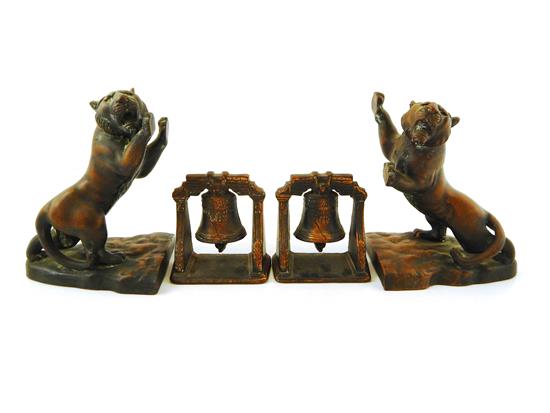 Appraisal: Four metal desk accessories two similar snarling tiger rampant bookends