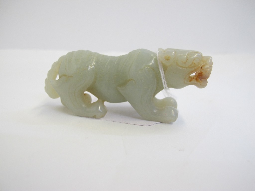 Appraisal: An Oriental celadon jade figure of a tiger