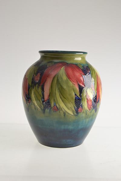 Appraisal: A MOORCROFT LEAF AND BLACKBERRY VASE ovoid in form decorated