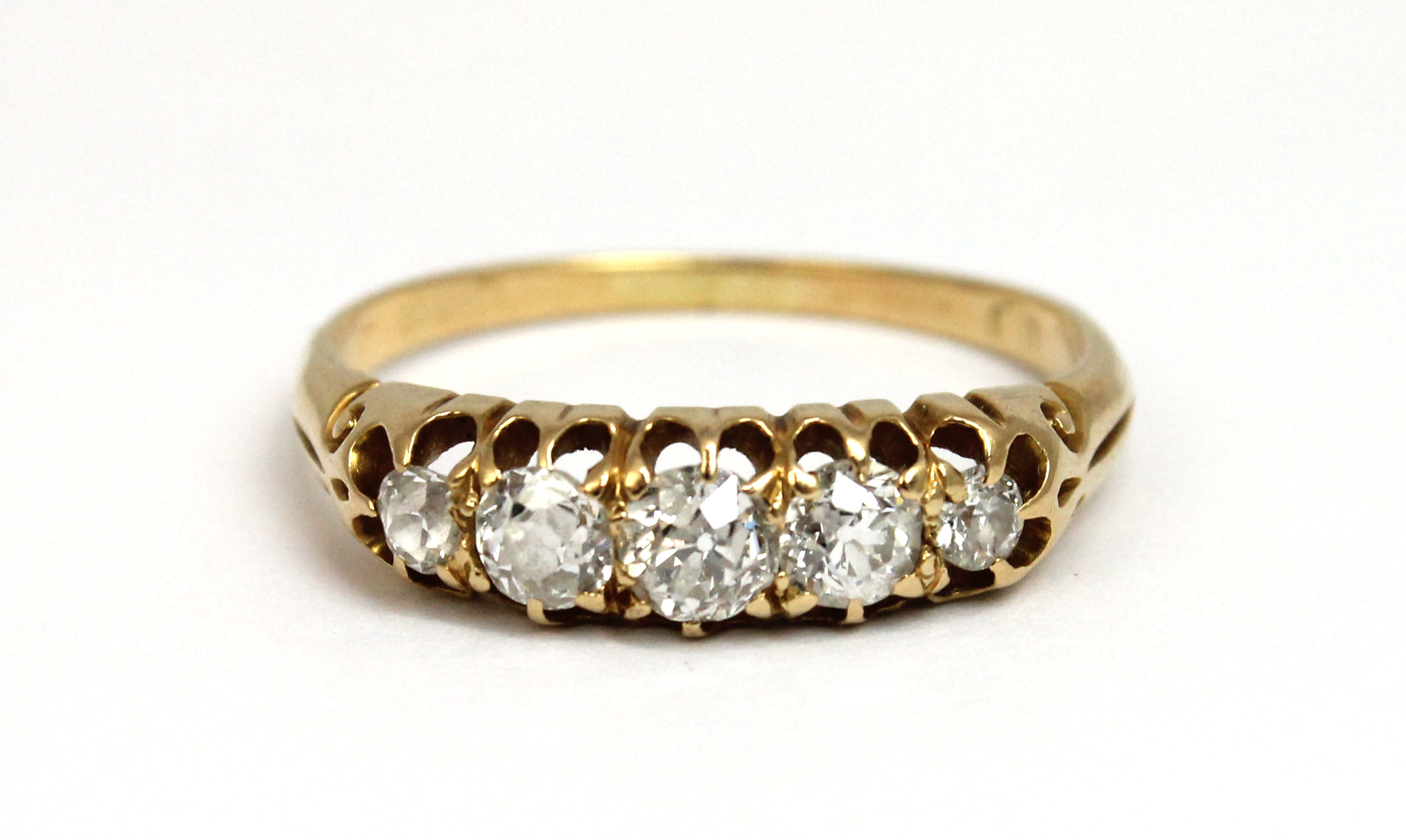 Appraisal: A gold and diamond set five stone ring mounted with