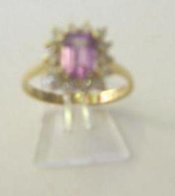 Appraisal: A PINK SAPPHIRE AND DIAMOND CLUSTER RING the emerald cut