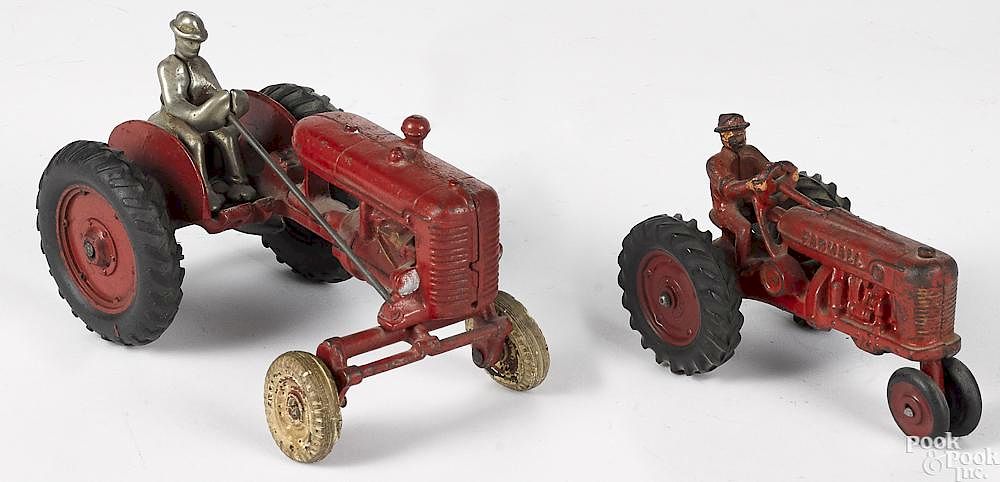 Appraisal: Two cast iron farm tractors Two cast iron farm tractors