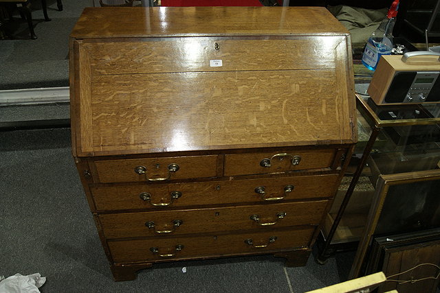 Appraisal: A TH CENTURY OAK BUREAU with bureau section above two