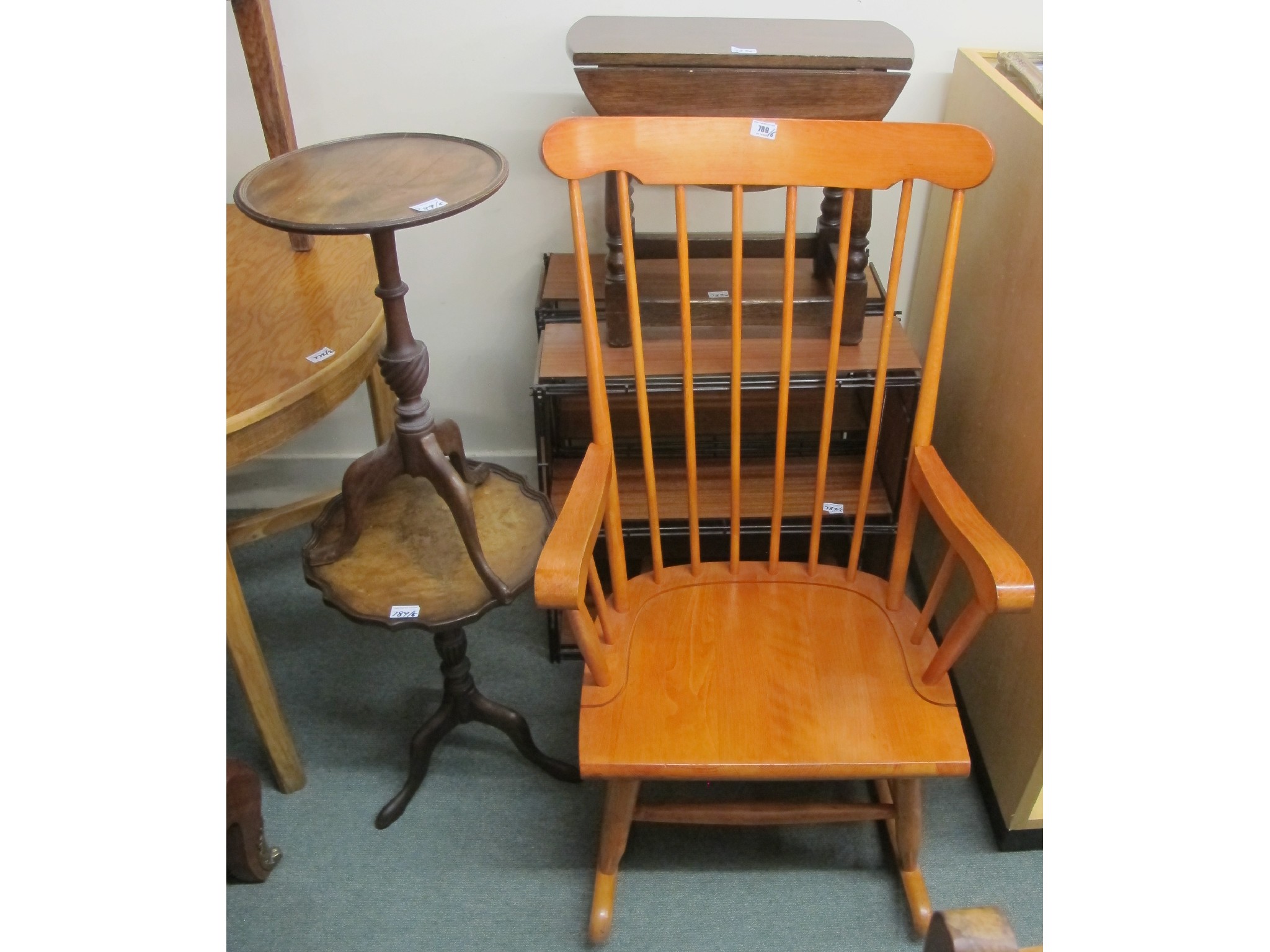 Appraisal: A pine rocking chair two shelving units two wine tables