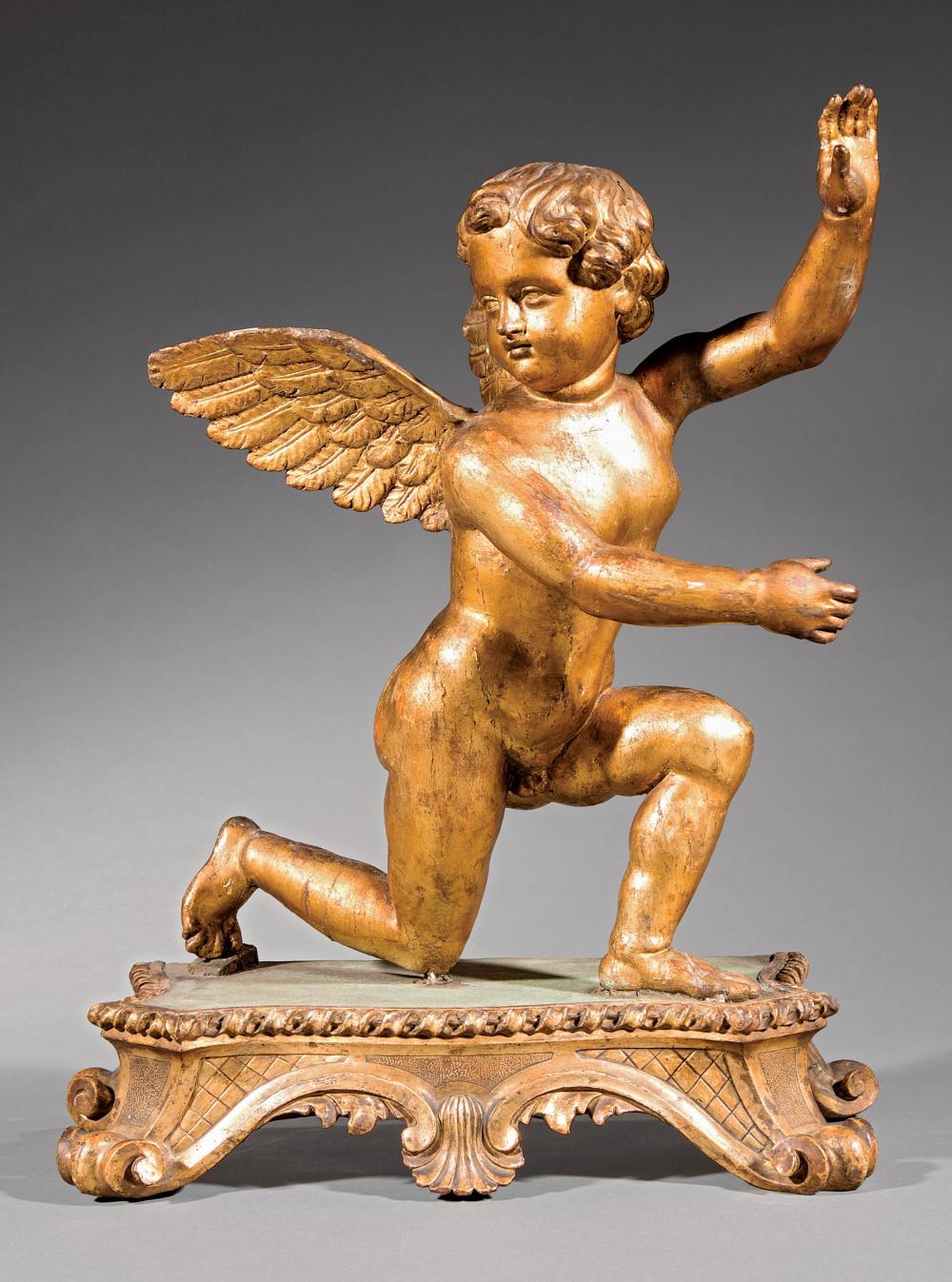 Appraisal: Italian Carved Giltwood Cherub th c kneeling on cartouche-form base